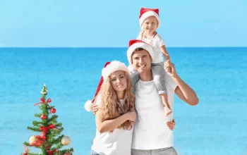 happy-family-christmas-tree-beach_392895-57216